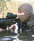 Person Holding a Rifle in the Water
